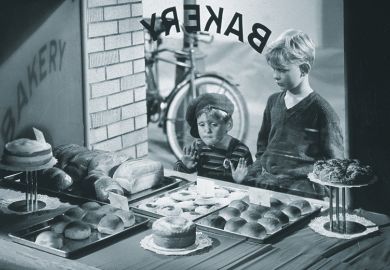 Kids looking through bakery window