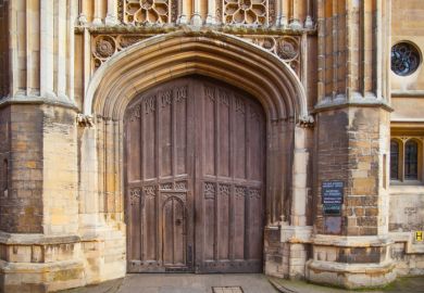 The closed gate of King's College, Cambridge, symbolising university access