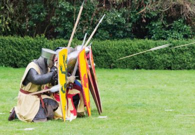 Knights seeking cover from arrows behind shields