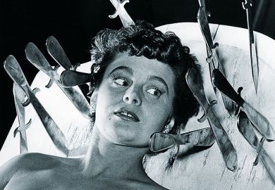 Woman with knives around her head Woman with knives around her head