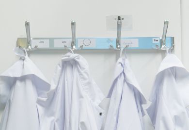 Lab coats on pegs