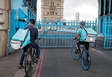 Deliveroo riders wait for Tower Bridge to open Deliveroo riders wait for Tower Bridge to open