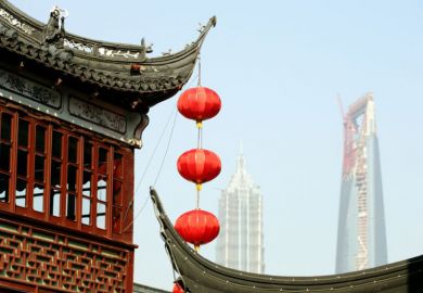Red lanterns hanging from a temple roof in Shanghai