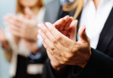 Line of people applauding