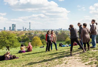 People photographing friends, Primrose Hill, London