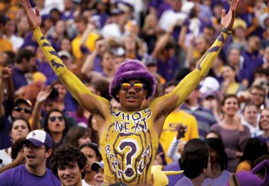 Louisiana State University student celebrating at American football game Louisiana State University student celebrating at American football game