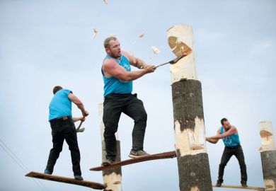 lumberjacks chop tree trunks in a lumberjack competition lumberjacks chop tree trunks in a lumberjack competition to illustrate University presidents are ‘driven by fear’ with him having to make cuts