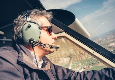 Male amateur pilot flying light aircraft