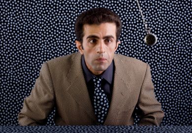 Man being hypnotised by swinging pendulum