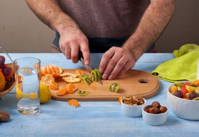 Man cutting fruit