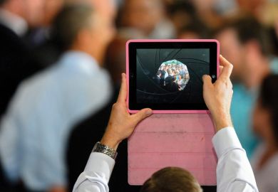 Man filming video using Apple iPad