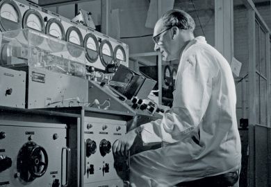 Man inspecting Keystrian magnetious valves at Mullard