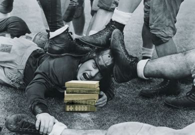 Man lying beneath rugby pile-up Man lying beneath rugby pile-up