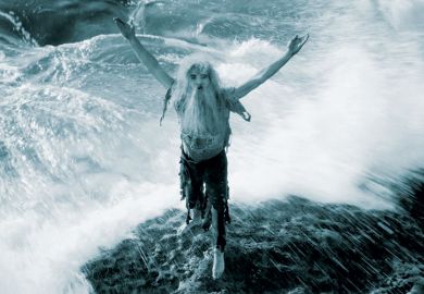 Man marooned on rock in ocean