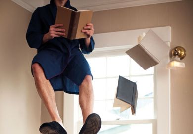 Man sitting and reading in mid air