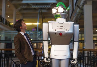 Man looking up at giant robot Man looking up at giant robot