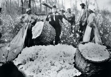 Man weighing basket of cotton balls, 1890s