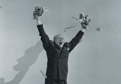 Man celebrating with hands full of cash