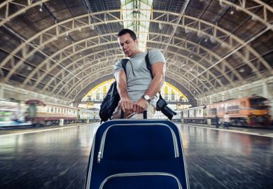 Man dragging heavy luggage