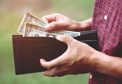 Man getting dollar notes out of wallet Man getting dollar notes out of wallet