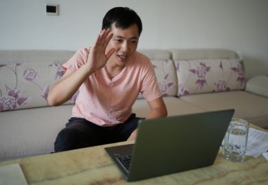 man having video conference at home