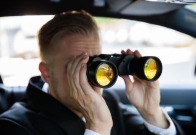 Man Looking Through Binoculars