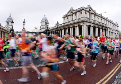 Runners pass by the University of Greenwich during the London Marathon. To illustrate accelerated degrees.