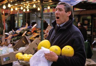 Market trader selling fruit, London Market trader selling fruit, London
