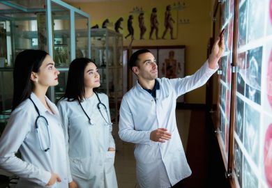 Medical students look at a chart