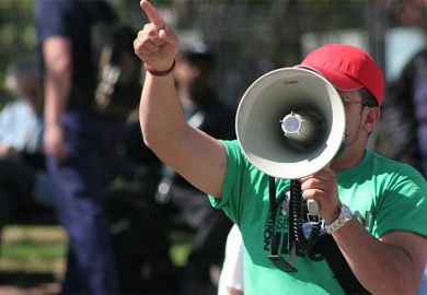 Man shouting into a megaphone Man shouting into a megaphone