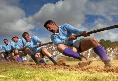 Men competing in tug of war