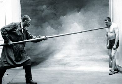 Men demonstrating jiu-jitsu martial art, France, 1906