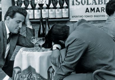 Men slumped at table