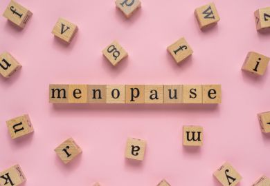 Scrabble tiles reading "menopause"