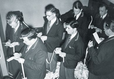 A group of men with ticker tape A group of men with ticker tape