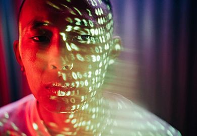 Numbers projected onto the face of an Asian man, symbolising metrics obsession