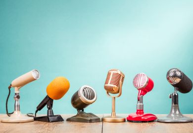 A row of microphones, symbolising media engagment