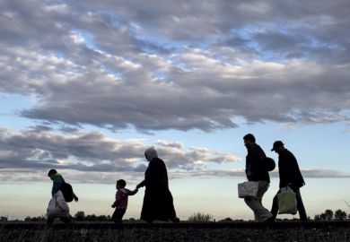 Migrants walk along rail tracks, Roszke, Hungary, 2015 Migrants walk along rail tracks, Roszke, Hungary, 2015