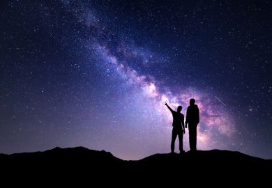 Two people staring into the night sky
