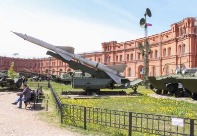 A Russian missile outside a grand building, illustrating the militarisation of universities