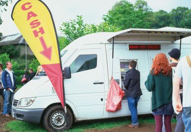 Mobile cash machine white van at the Green Man Festival Wales UK