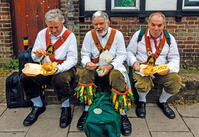 Morris dancers eat fish and chips