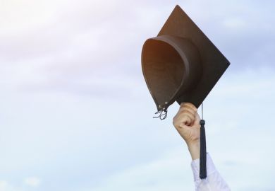 A mortarboard in the air