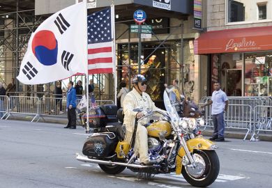 Korean Day Parade along Avenue of the Americas in New York, USA. Motorbike with American and Korean flags Korean Day Parade along Avenue of the Americas in New York, USA. Motorbike with American and Korean flags