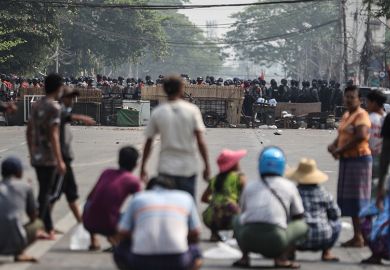 Myanmar riot police blocked the road in front of the protesters during a protest against the military coup in Yangon, Myanmar on March 3, 2021.