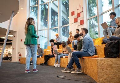 A student gives a talk in front of her colleagues