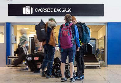 Passengers with luggage queue in front of the airport’s oversized baggage counter. To illustrate that the proposed levy on international students could put jobs at risk, and imposing the levy on students could be too much for them to bear.