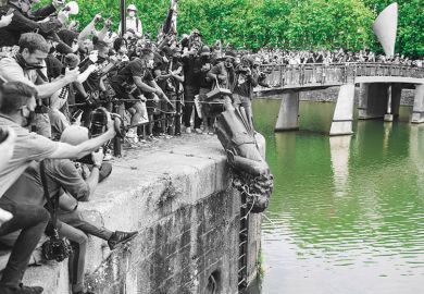 The statue of Edward Colston is pushed into the river Avon