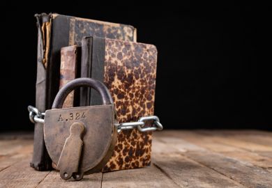 Padlocked books, symbolising restrictions on liberal arts
