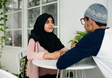 A Pakistani man and woman talking